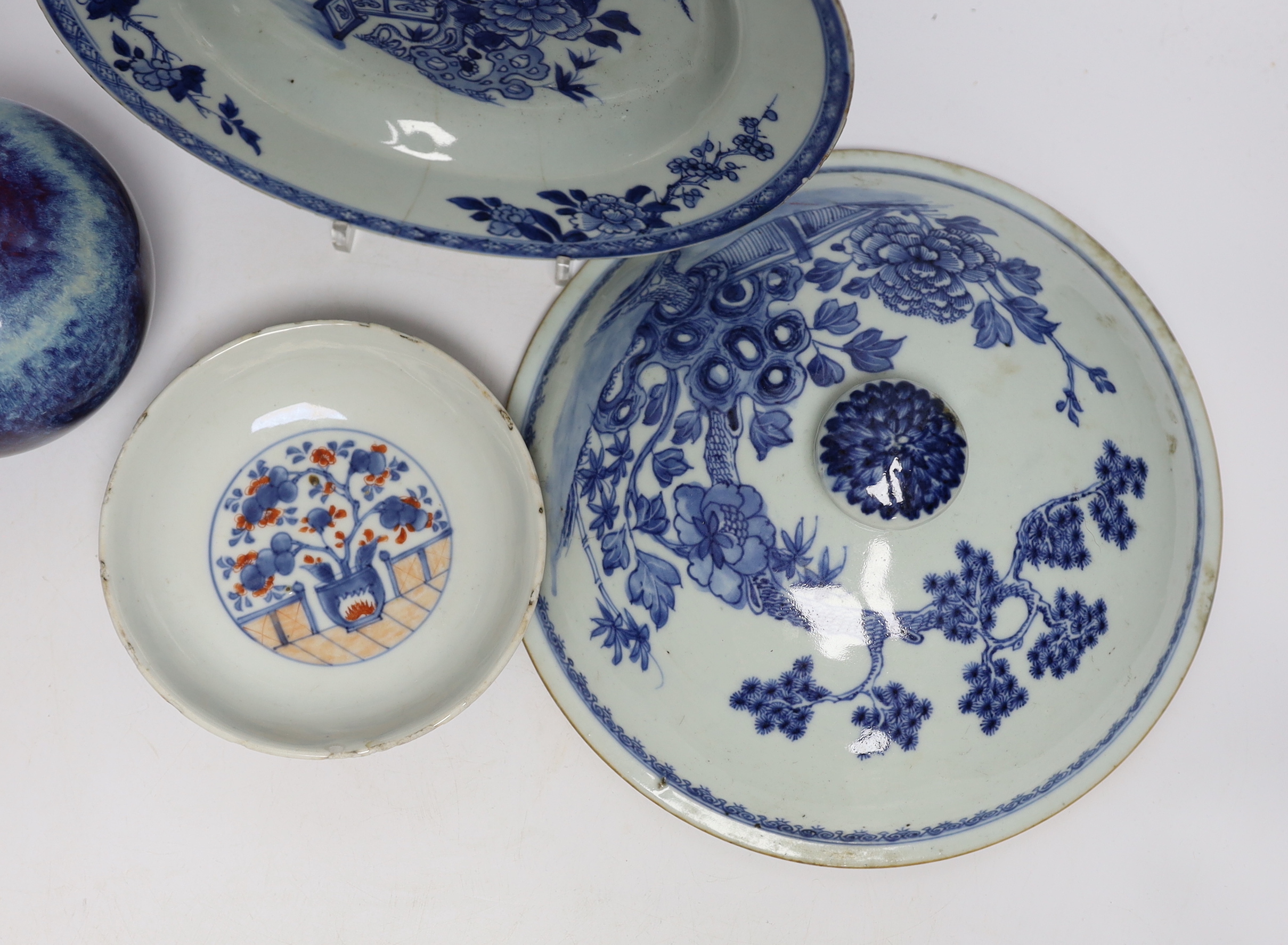 A group of Chinese ceramics including a flambé vase, an 18th century blue and white floral plate and a similar lid, 25cm diameter